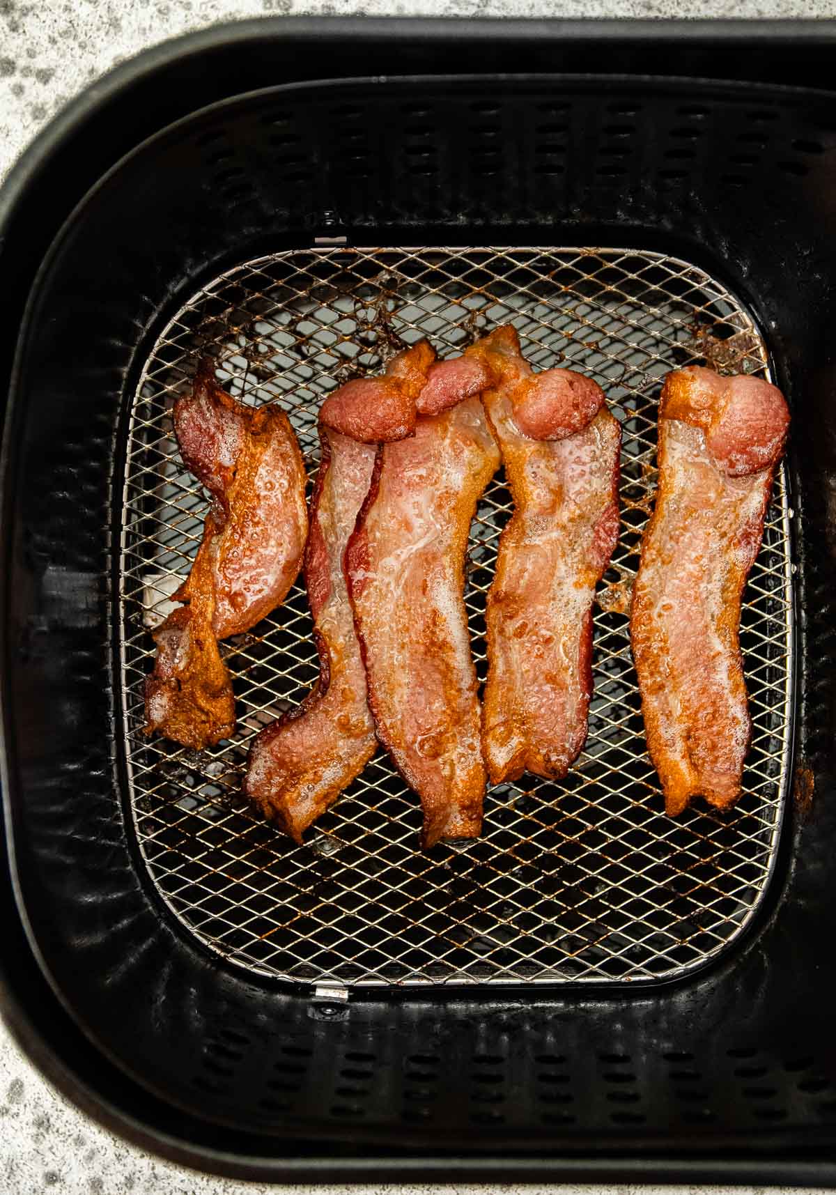 Air Fryer Bacon in air fryer basket