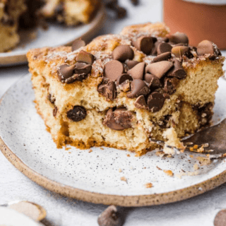slice of cake on a plate with a bite taken