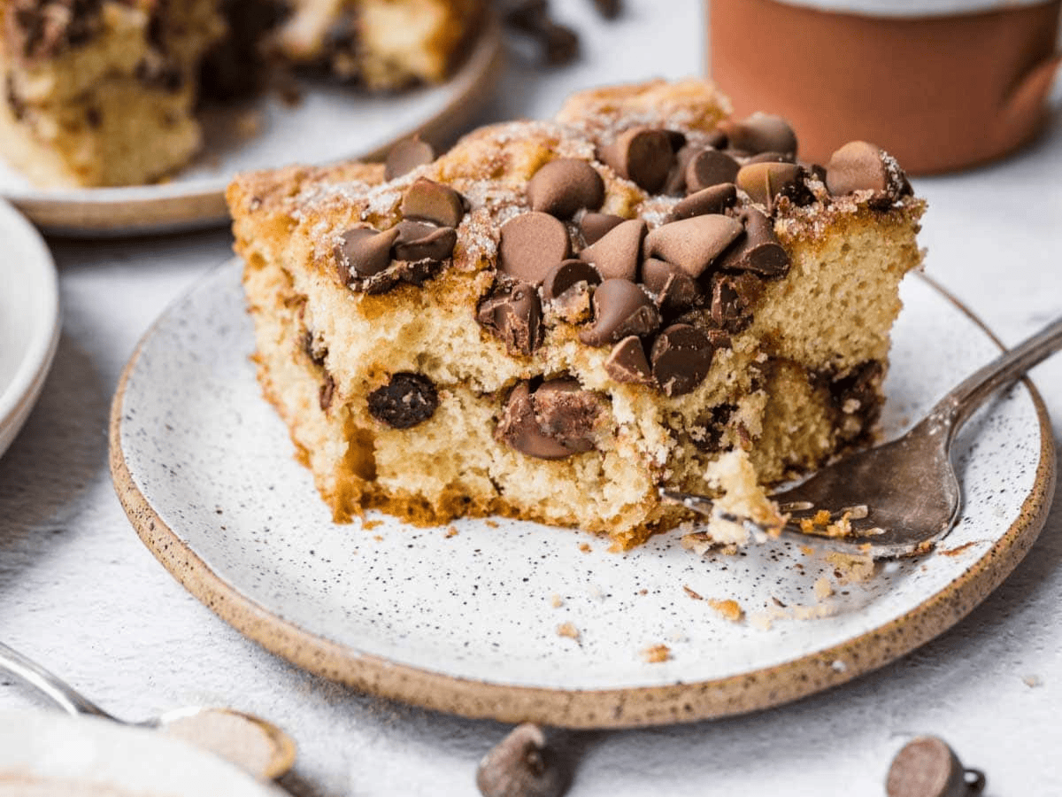 slice of cake on a plate with a bite taken 