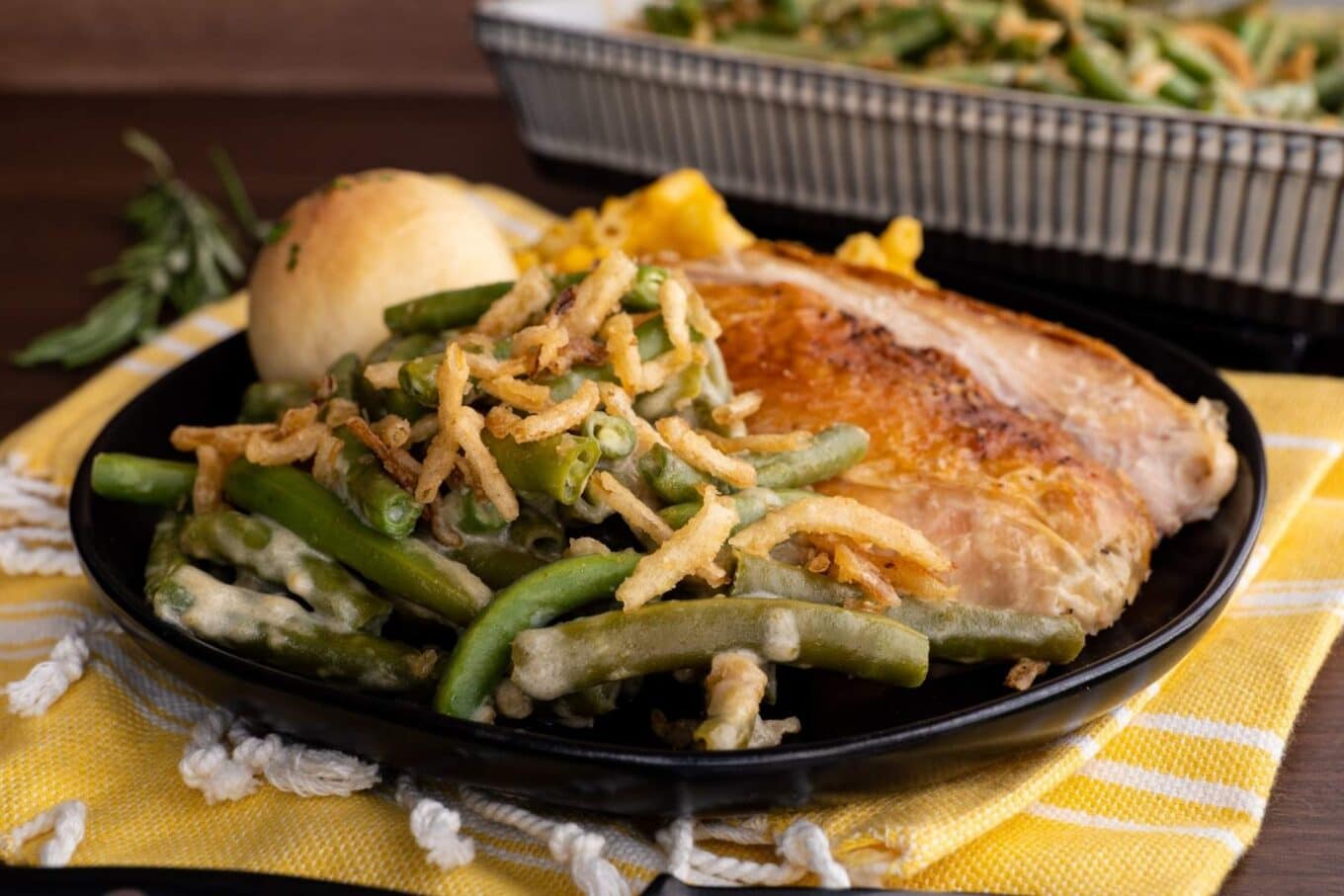 Green Bean Casserole on plate with turkey breast