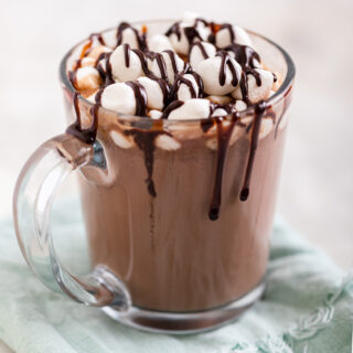 Slow Cooker Hot Chocolate in mug with chocolate drizzle