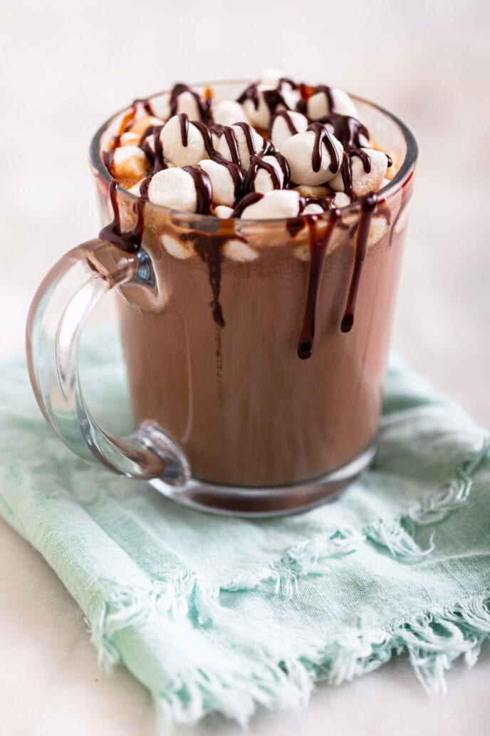 Slow Cooker Hot Chocolate in mug with chocolate drizzle