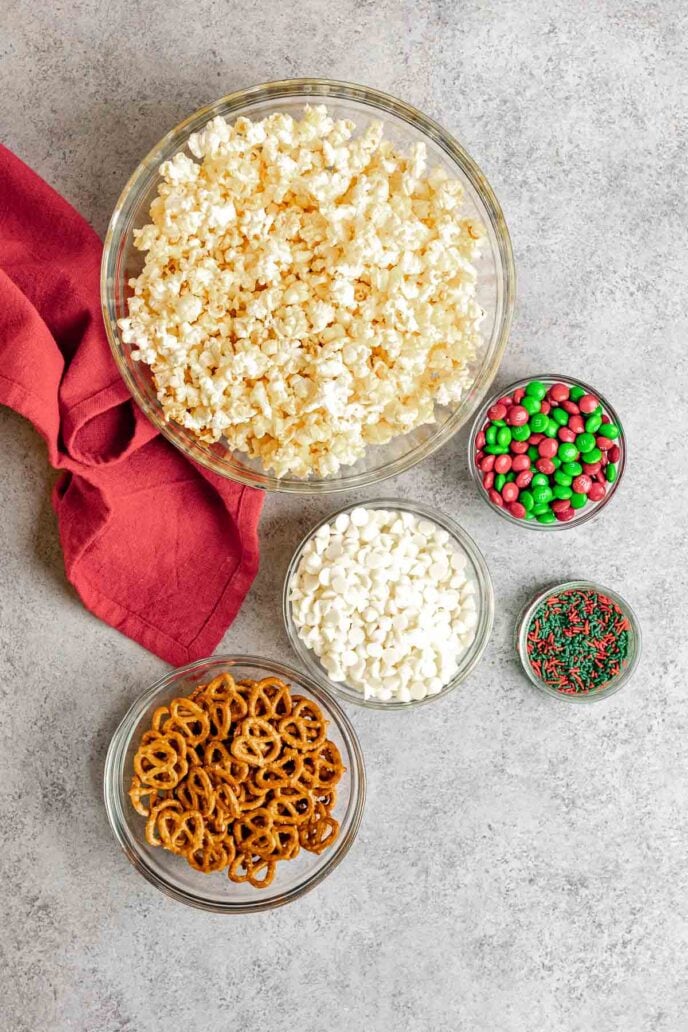 Christmas Popcorn Crunch ingredients in separate Bowls