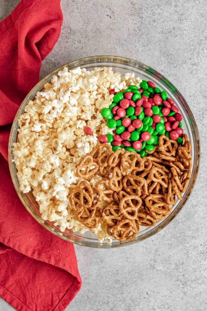 Christmas Popcorn Crunch ingredients in Bowl not mixed