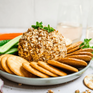 Cheese ball on a plate with crackers
