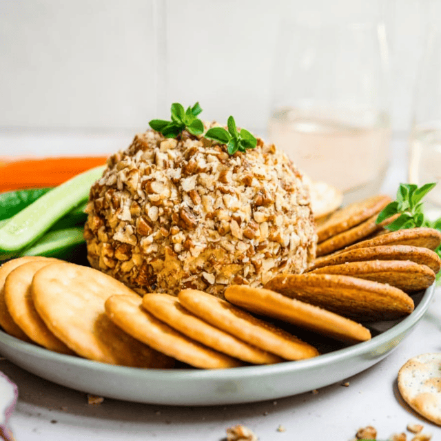 Cheese ball on a plate with crackers