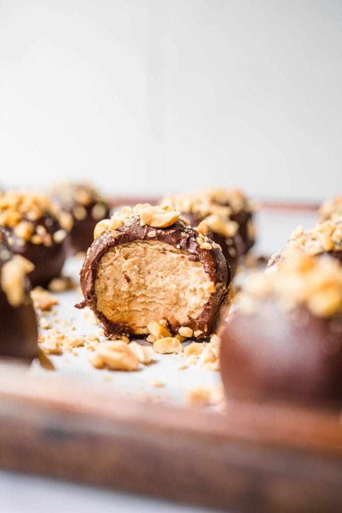 Peanut Butter Truffles with Chocolate Coating and Peanuts Shaped and on baking tray