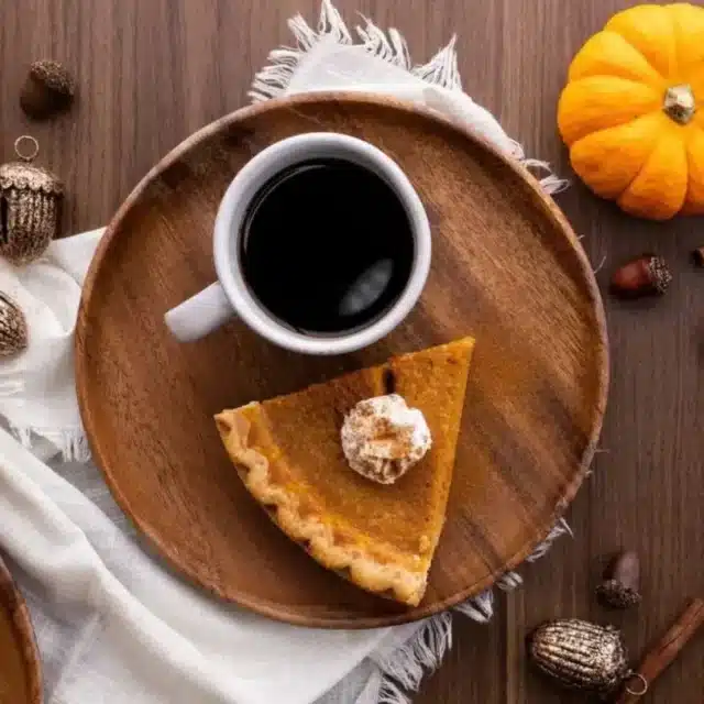 Pie served on plate with cup of coffee