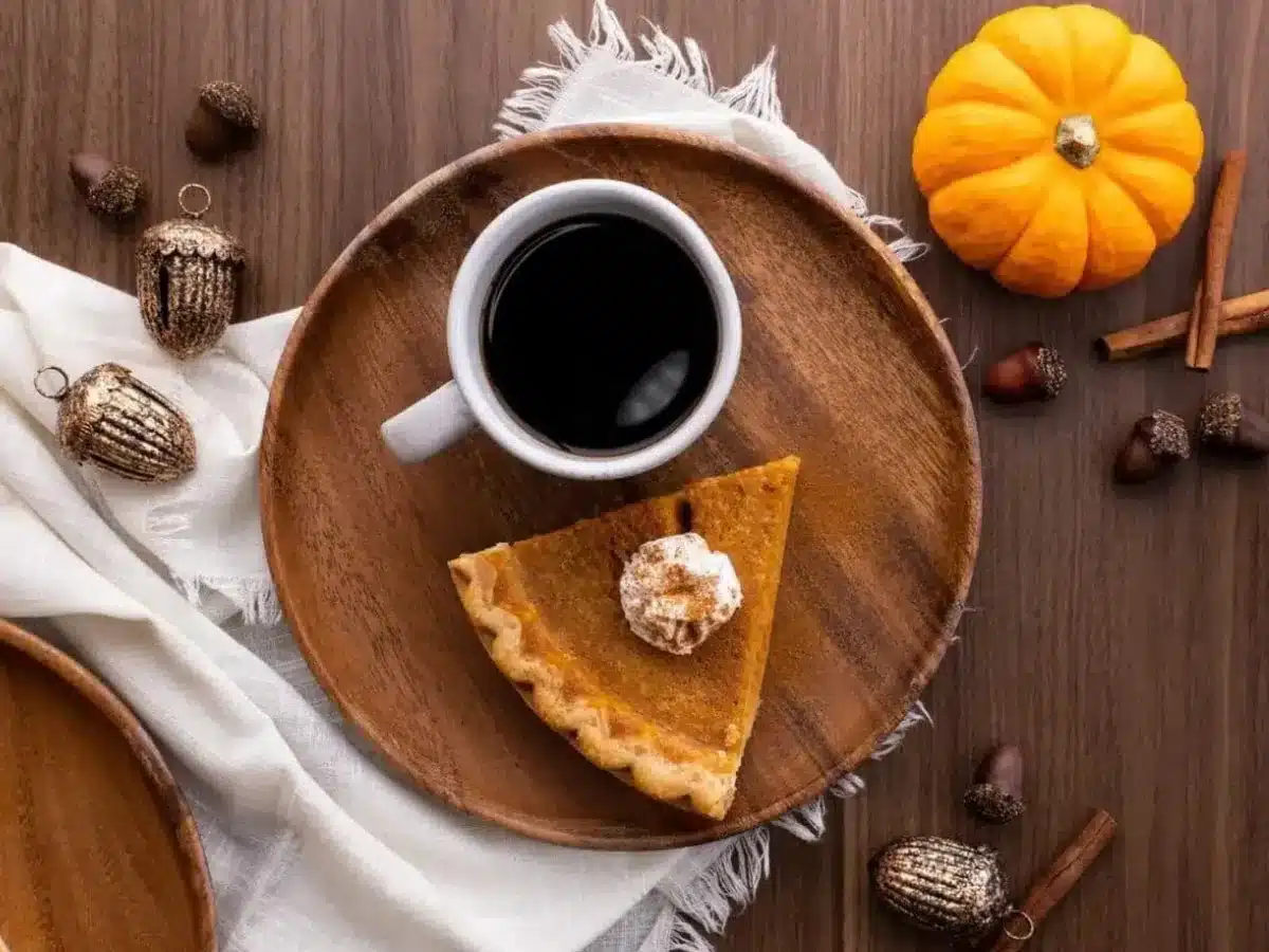 Pie served on plate with cup of coffee