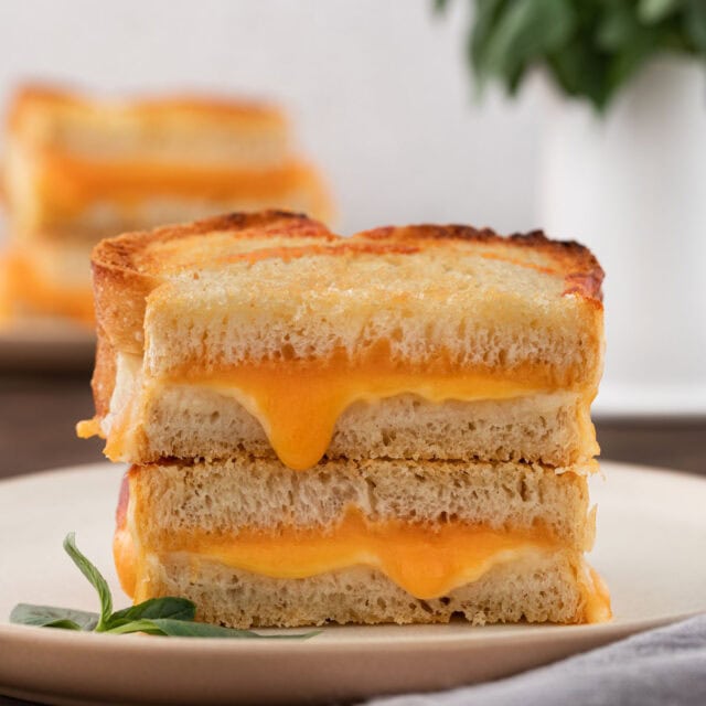 plate with sliced Air Fryer Grilled Cheese