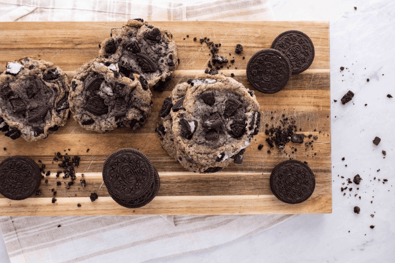 Cookies and Oreos on a wooden board
