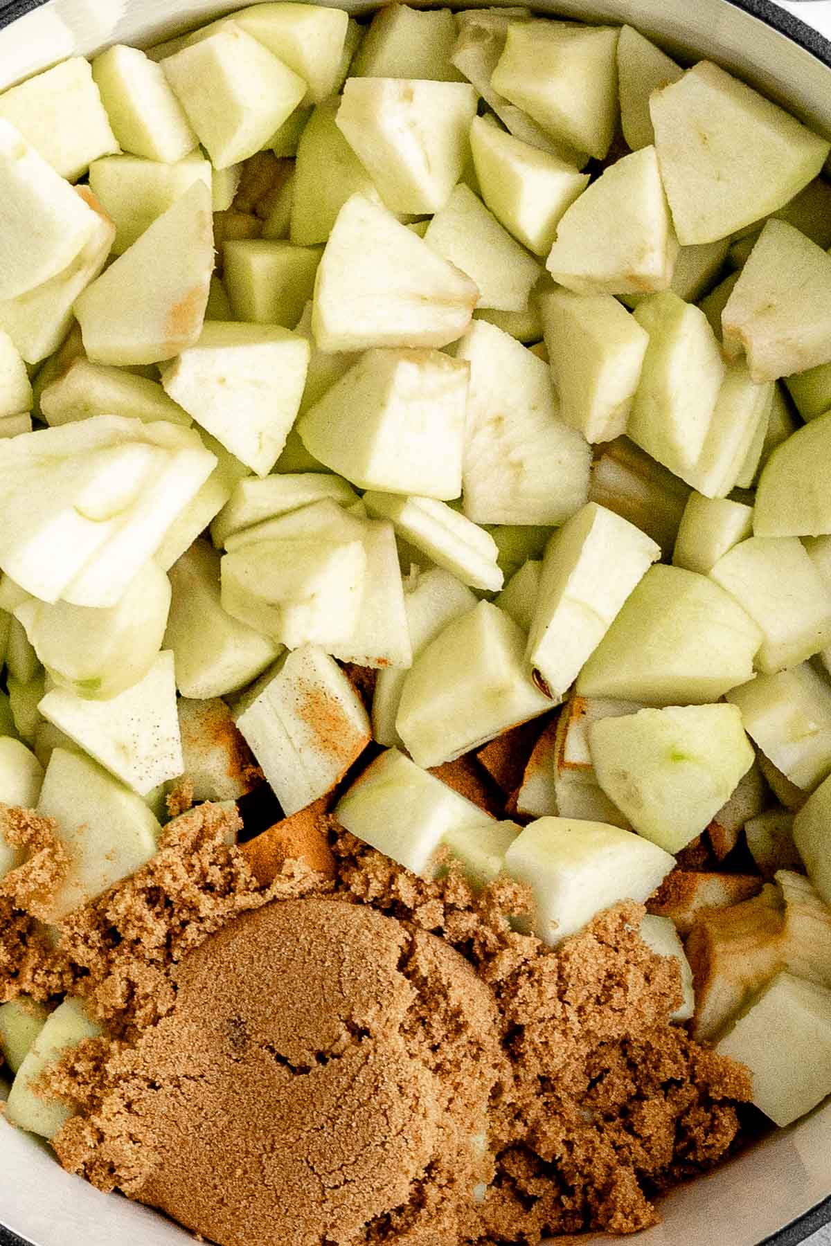 Baked Applesauce chopped apples with brown sugar in pan