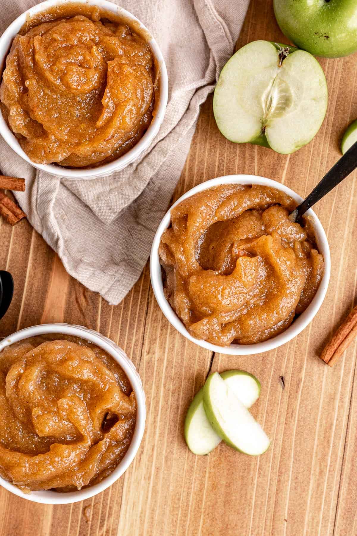 Baked Applesauce in White Bowls with Spoon