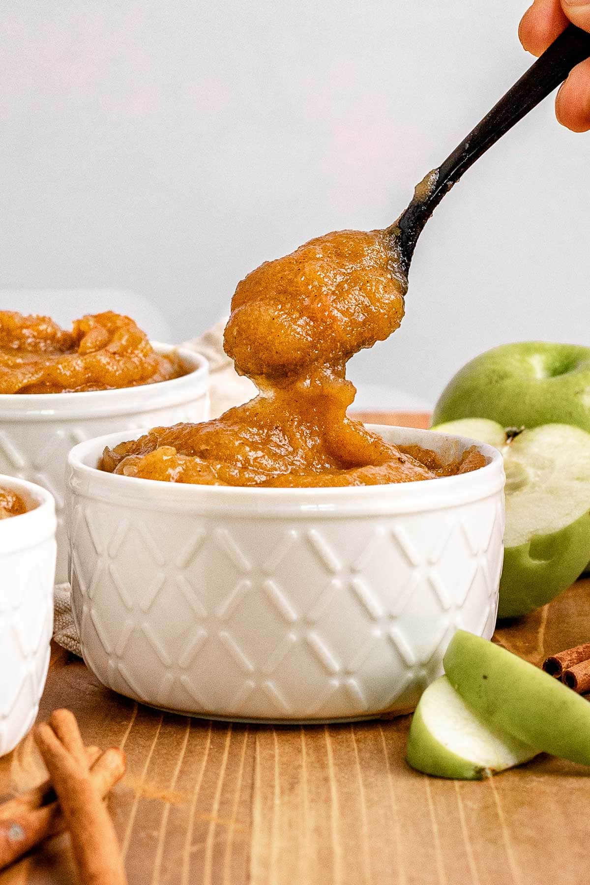 Baked Applesauce in White Bowl and on Spoon