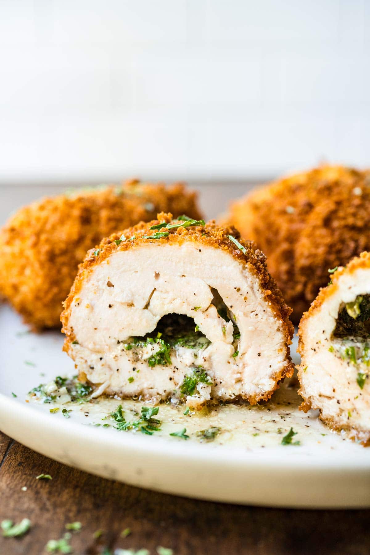 Chicken Kiev close up cut in half on plate