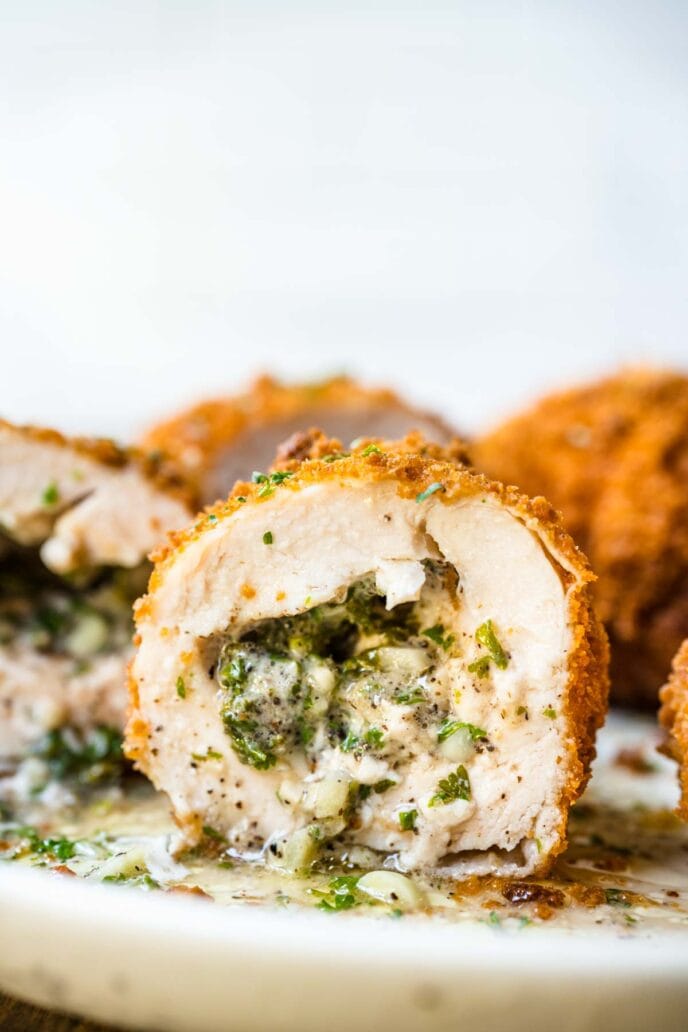 Chicken Kiev close up cut in half on plate