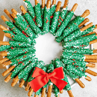 pretzels arranged in wreath shape with red bow