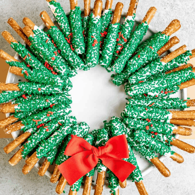 pretzels arranged in wreath shape with red bow