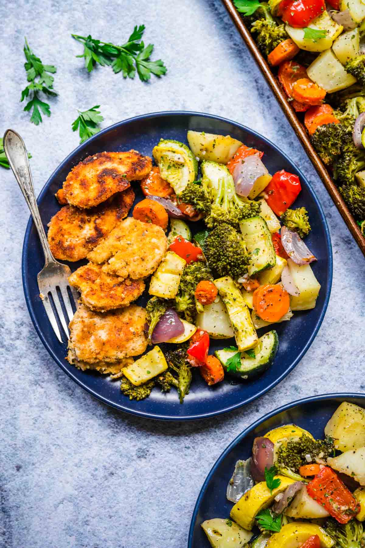 Easy Roasted Vegetables on serving plate with main dish