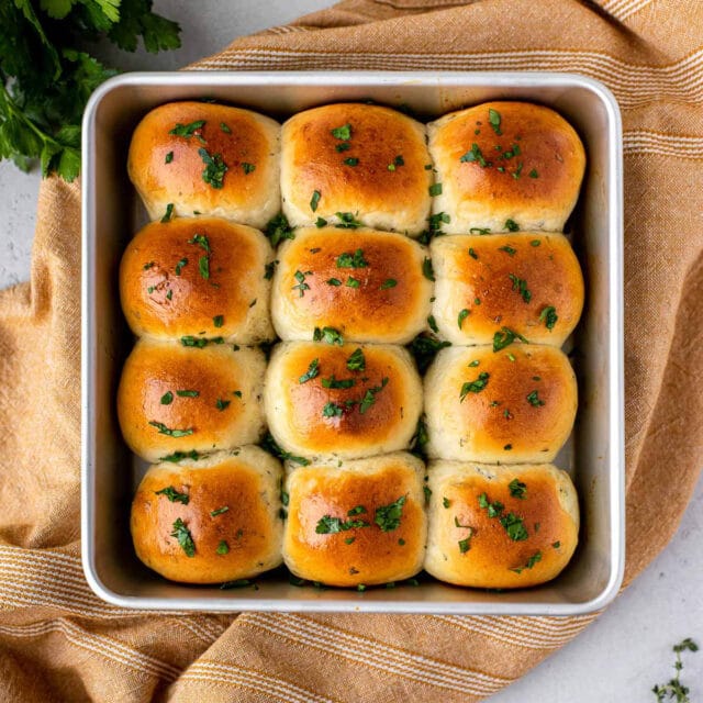 8x8 inch pan with 12 cooked dinner rolls