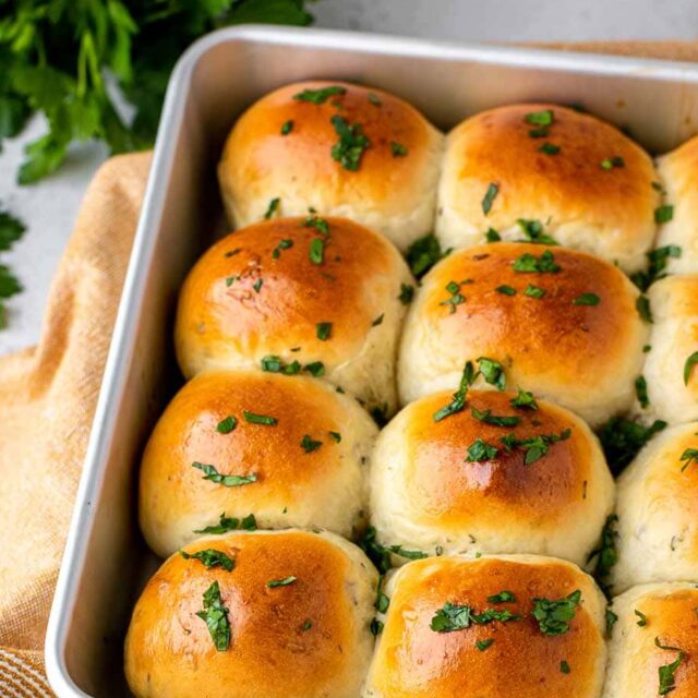 cooked rounded bread in baking pan