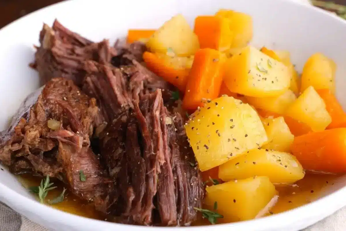 Potatoes, beef, and carrots in a serving dish