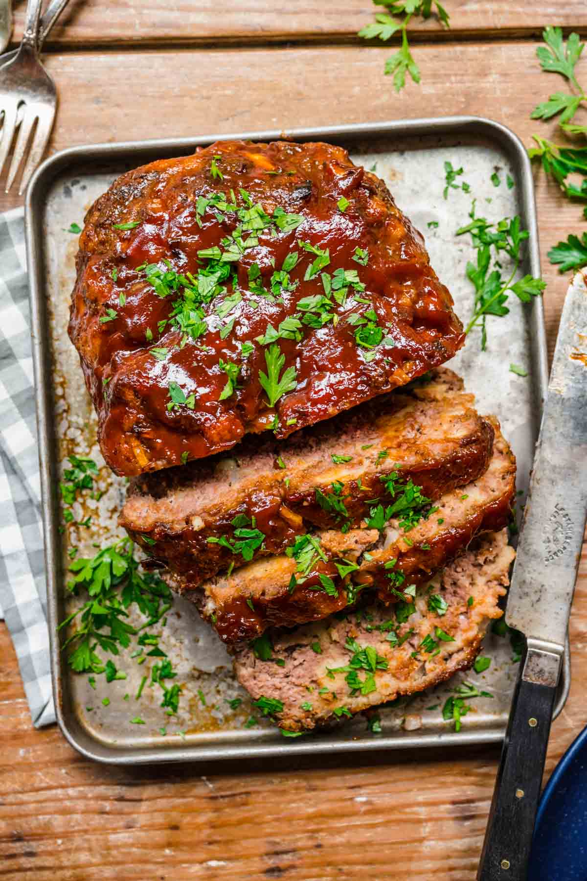 Instant Pot Meatloaf finished with glaze and garnish sliced on tray