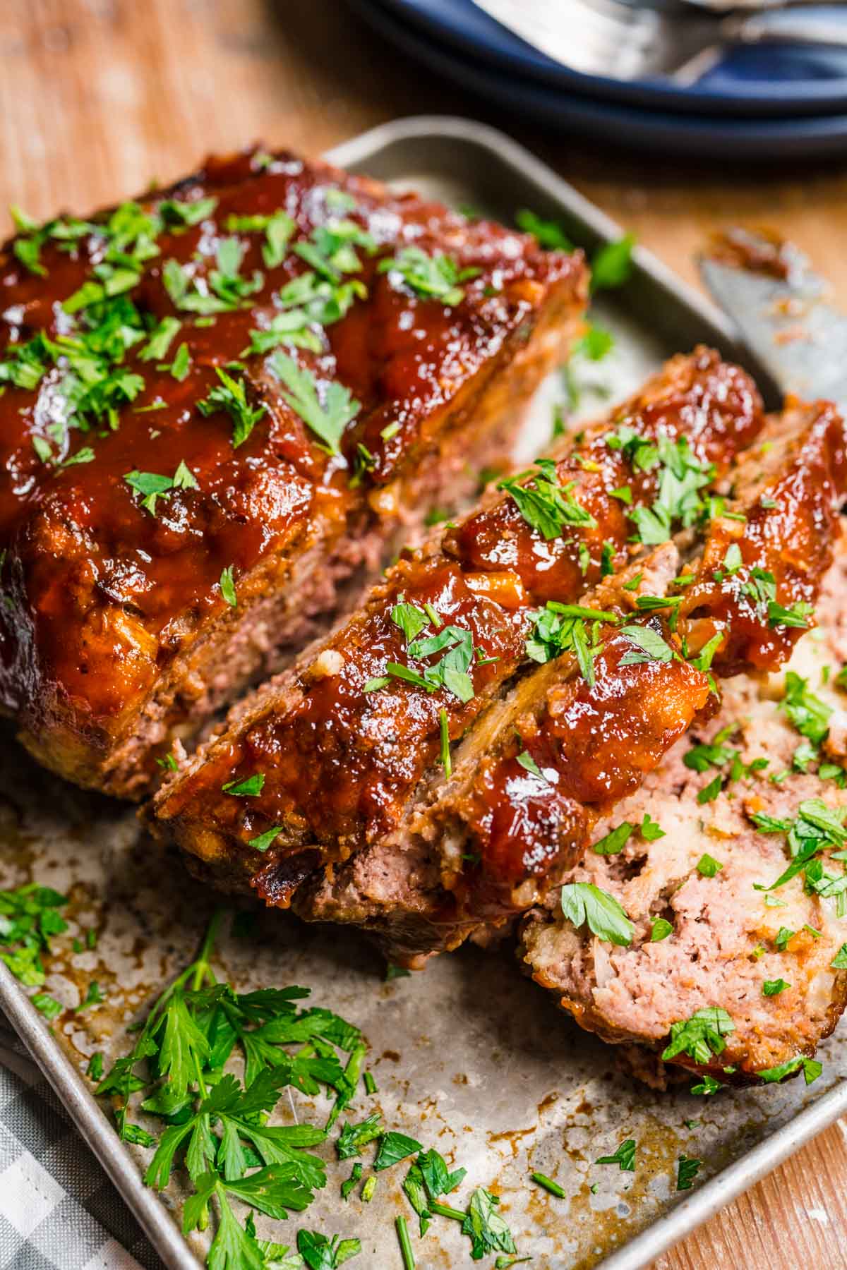 Instant Pot Meatloaf finished with glaze and garnish sliced on tray