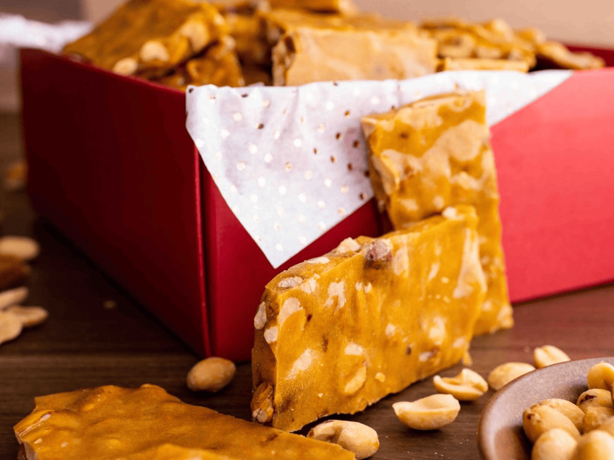 crunchy golden treats packed with nuts resting on a table in a box