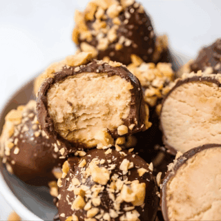 Creamy round treats stacked on one another on a plate