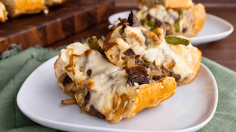 Slices of baked cheesy bread on plate