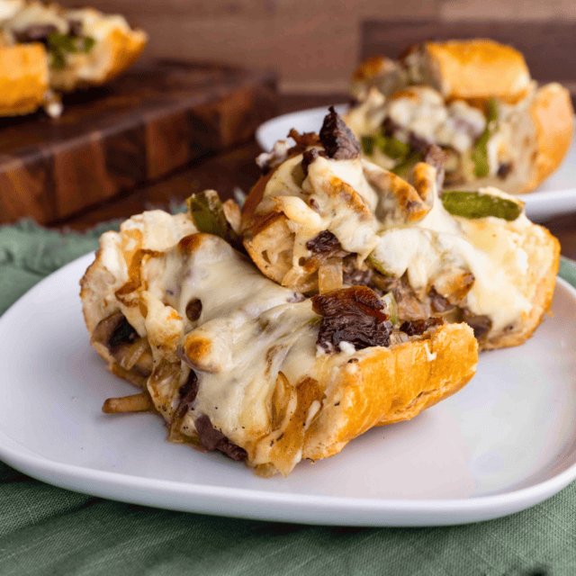 Slices of baked cheesy bread on plate