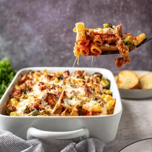 Baked Rigatoni in baking dish with spatula serving