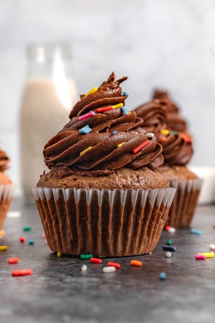 Brownie Cupcakes frosted with wrapper partially removed