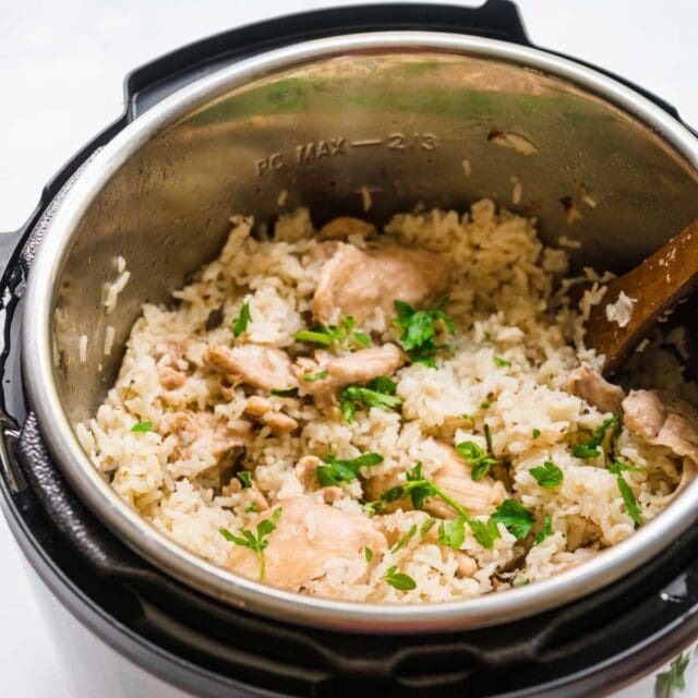 Instant Pot Chicken and Rice finished in instant pot with wooden spoon