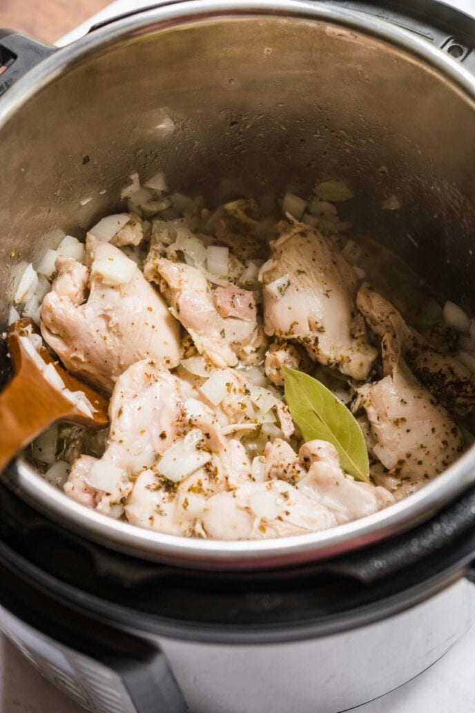 Instant Pot Chicken and Rice finished in instant pot with wooden spoon