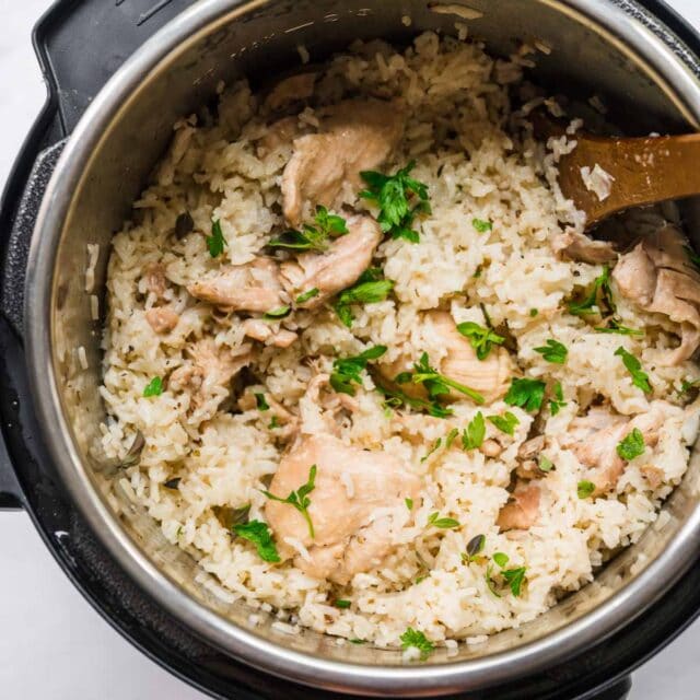 Instant Pot Chicken and Rice finished in instant pot with wooden spoon