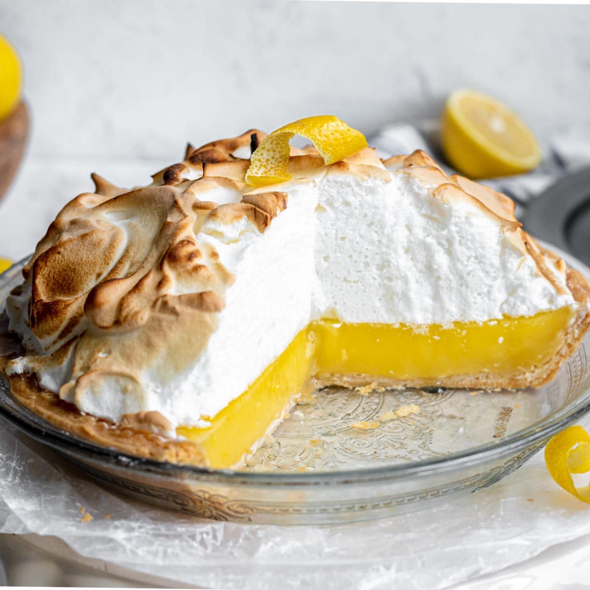 Lemon Meringue Pie in dish Side View slice removed