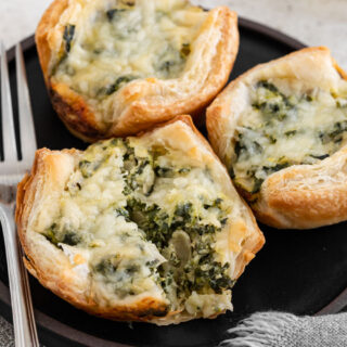 Savory filled puff pastries on appetizer plate.