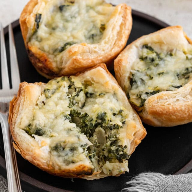 Savory filled puff pastries on appetizer plate.