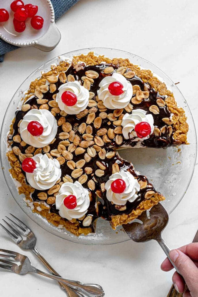 Tin Roof Sundae Pie with a slice cut out