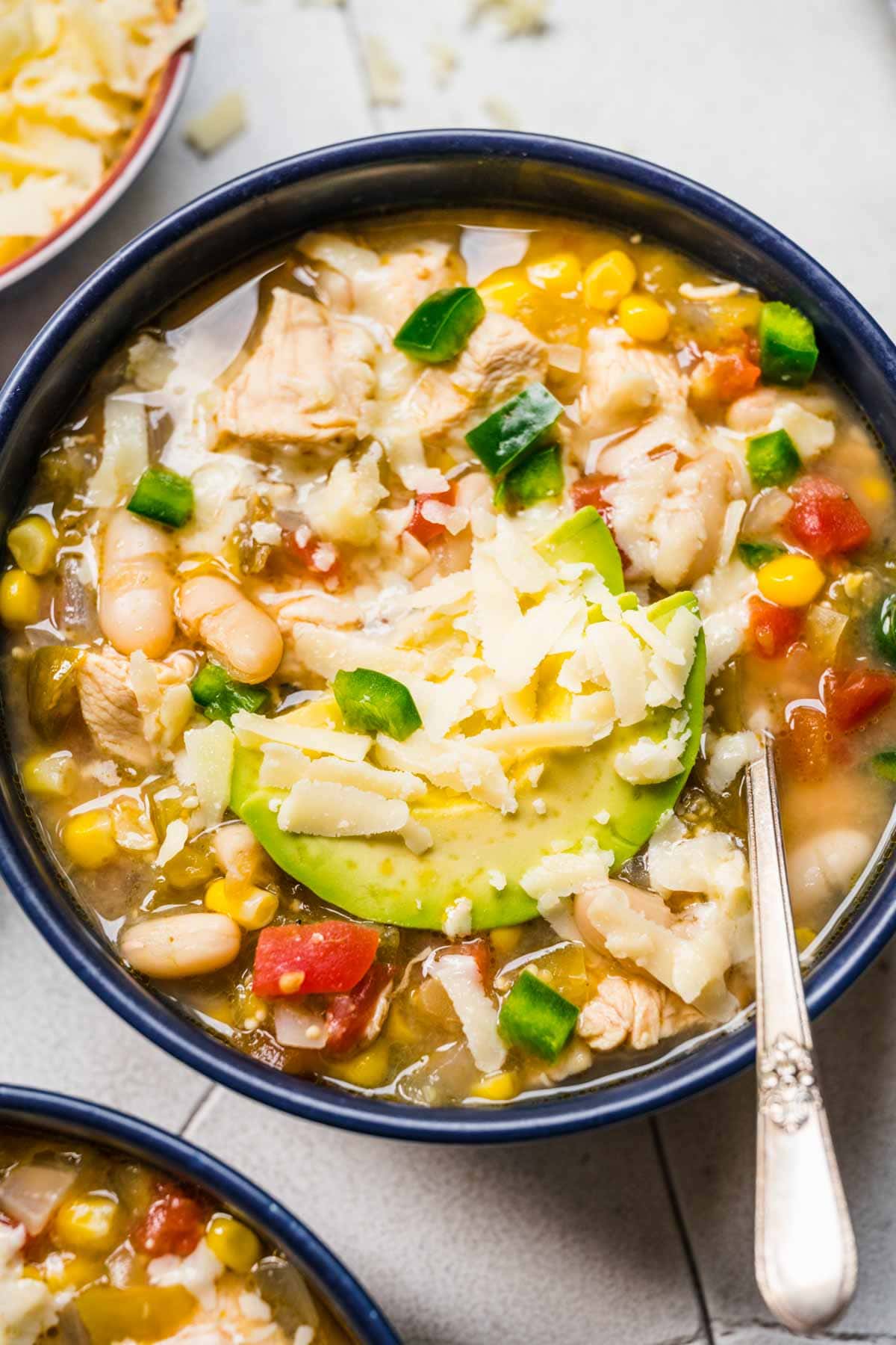 White Bean Chicken Chili served in bowl with garnish