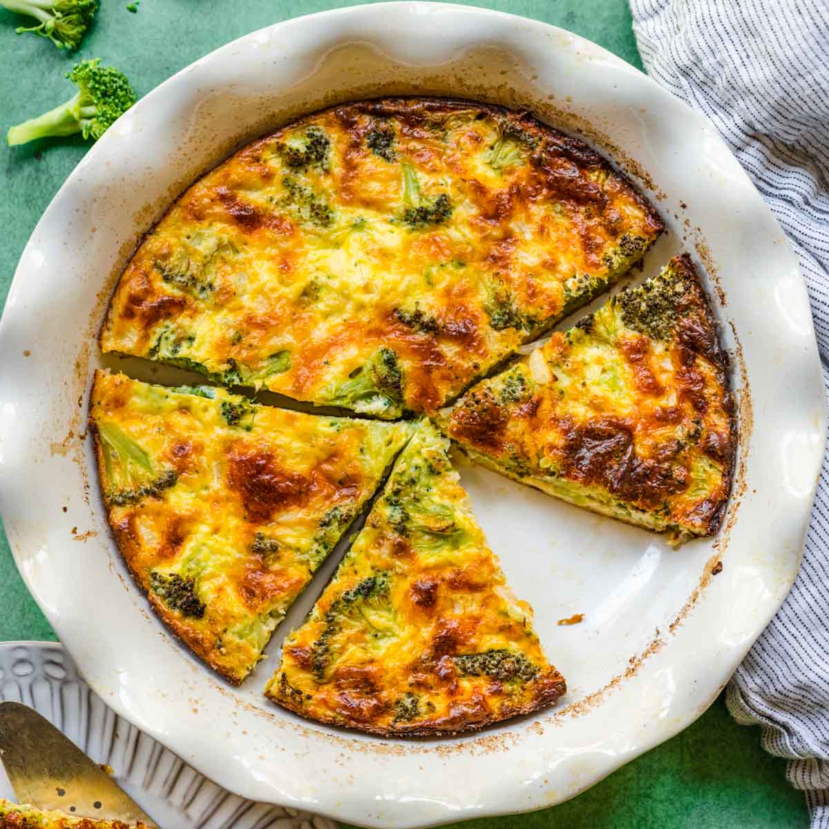 Broccoli Pie baked in pie dish cut with slice removed