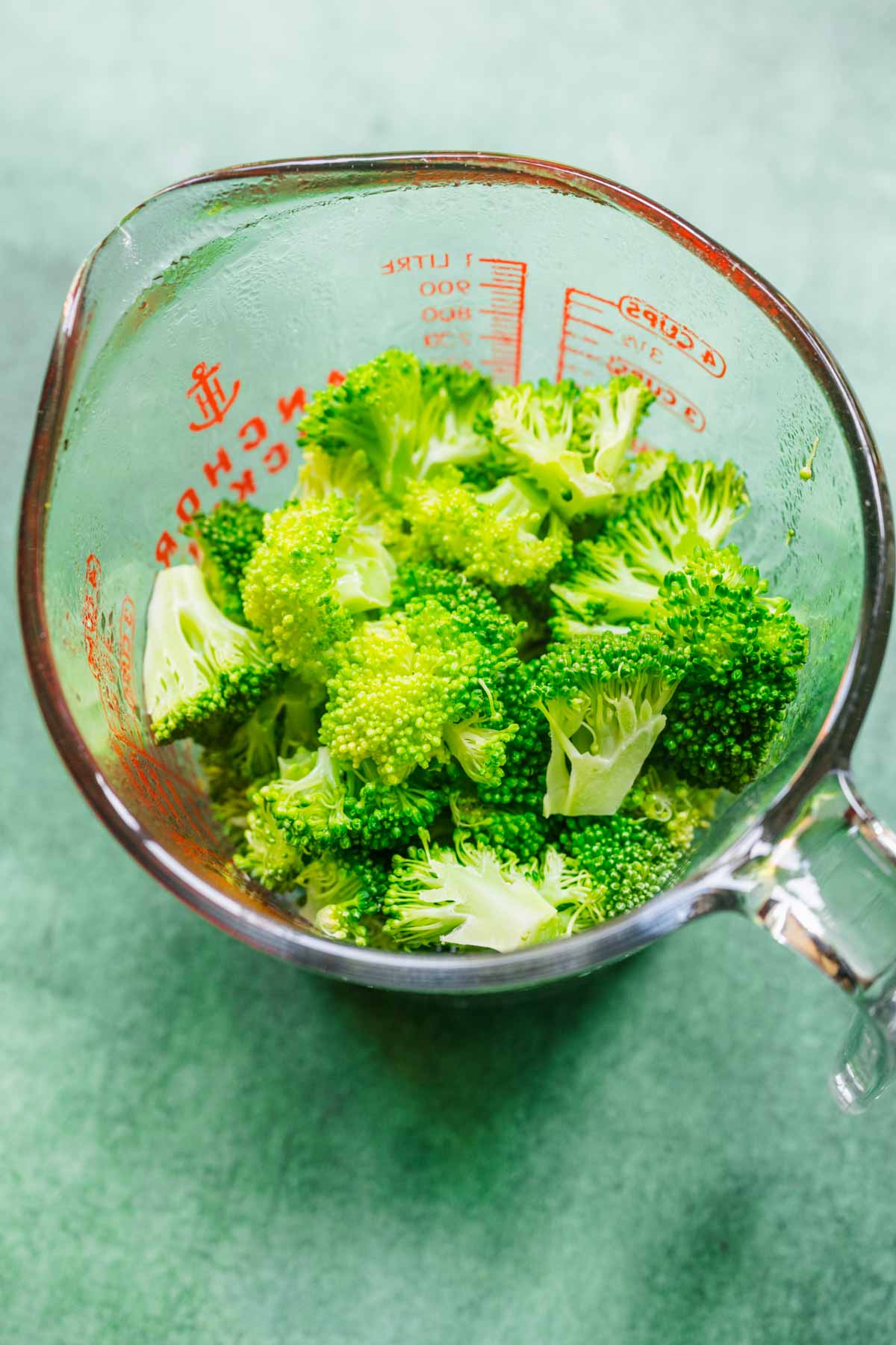 Broccoli Pie chopped raw broccoli in glass measuring cup