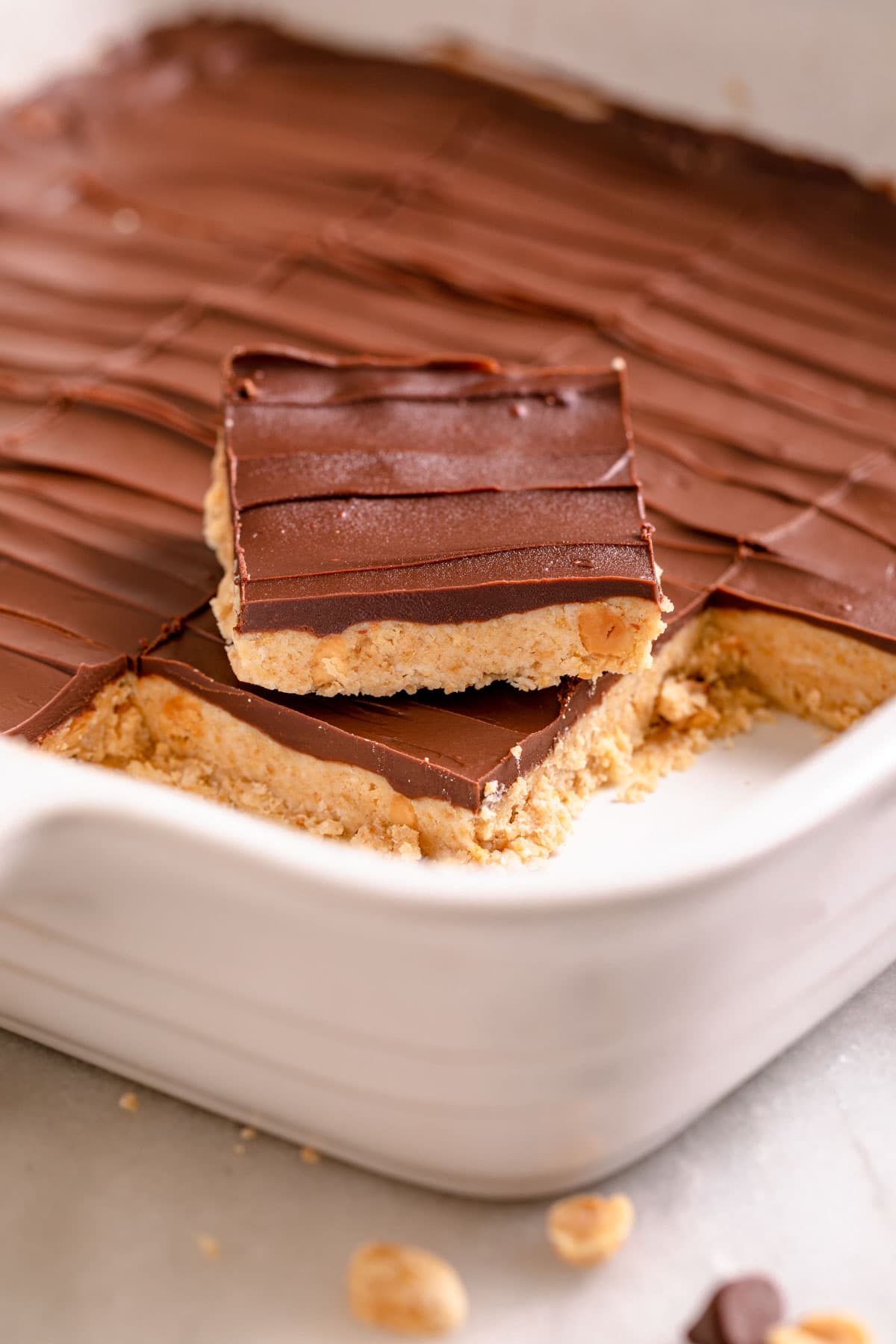 Chocolate Peanut Butter Bars cut in baking dish
