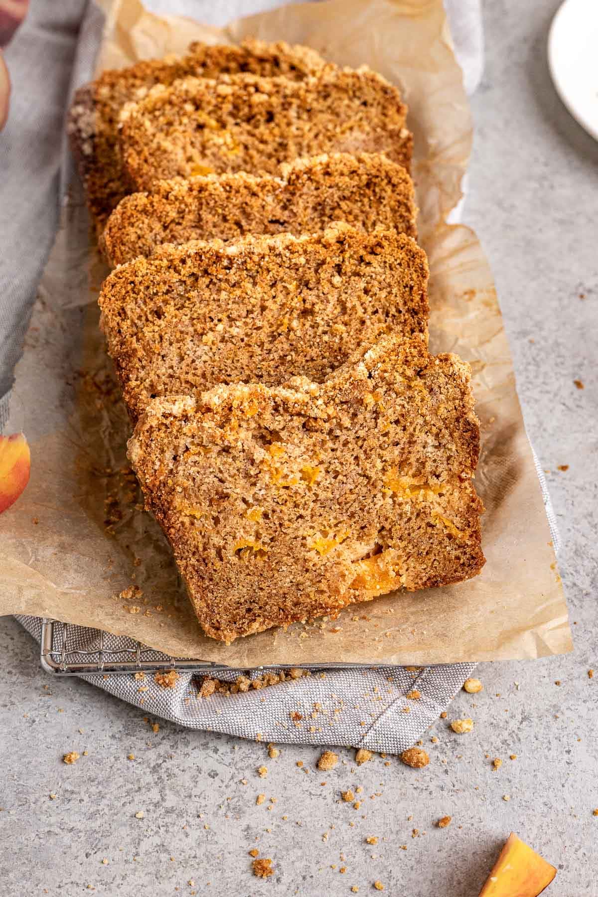 Cinnamon Streusel Peach Bread sliced on serving platter