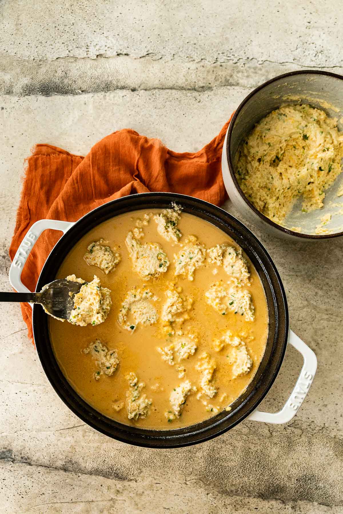 Corn Chowder with Cornmeal Dumplings dropping in dumpling mixture