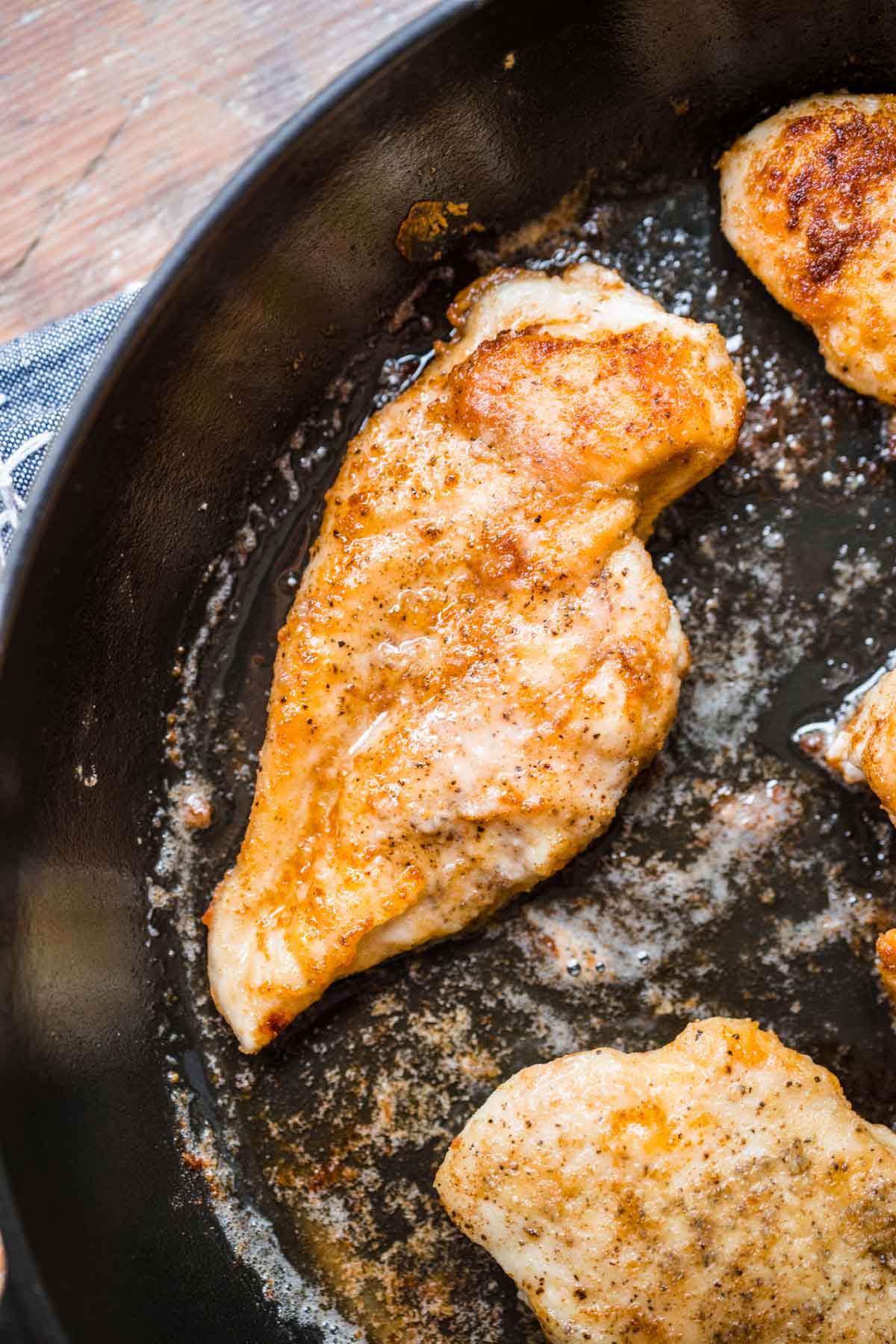 Lemon Chicken cooking chicken in pan