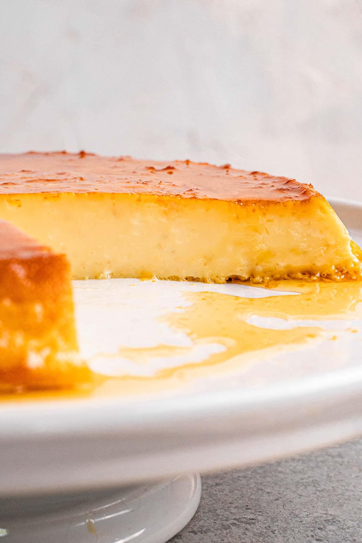 Mexican Caramel Flan on plate with slice removed