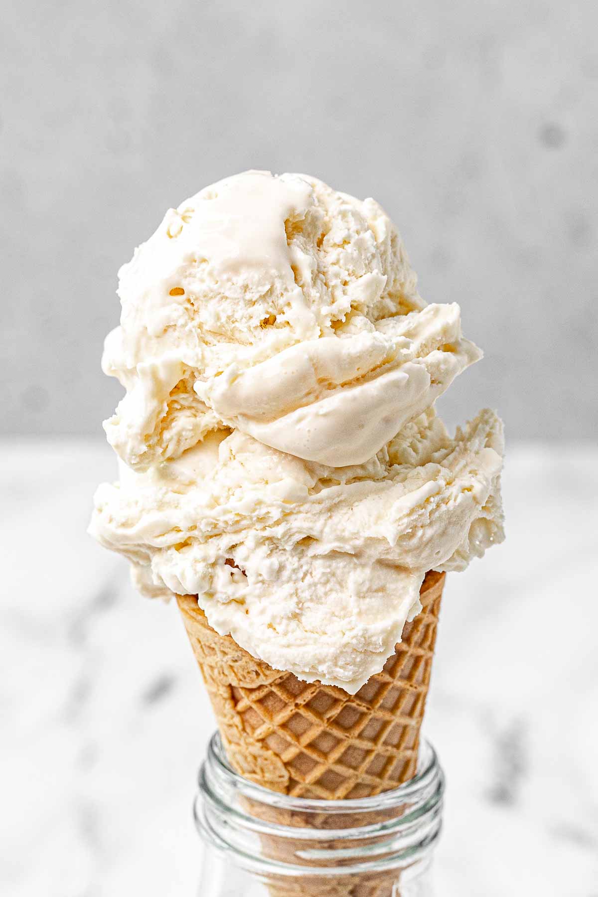 No Churn Vanilla Ice Cream scoops on cone